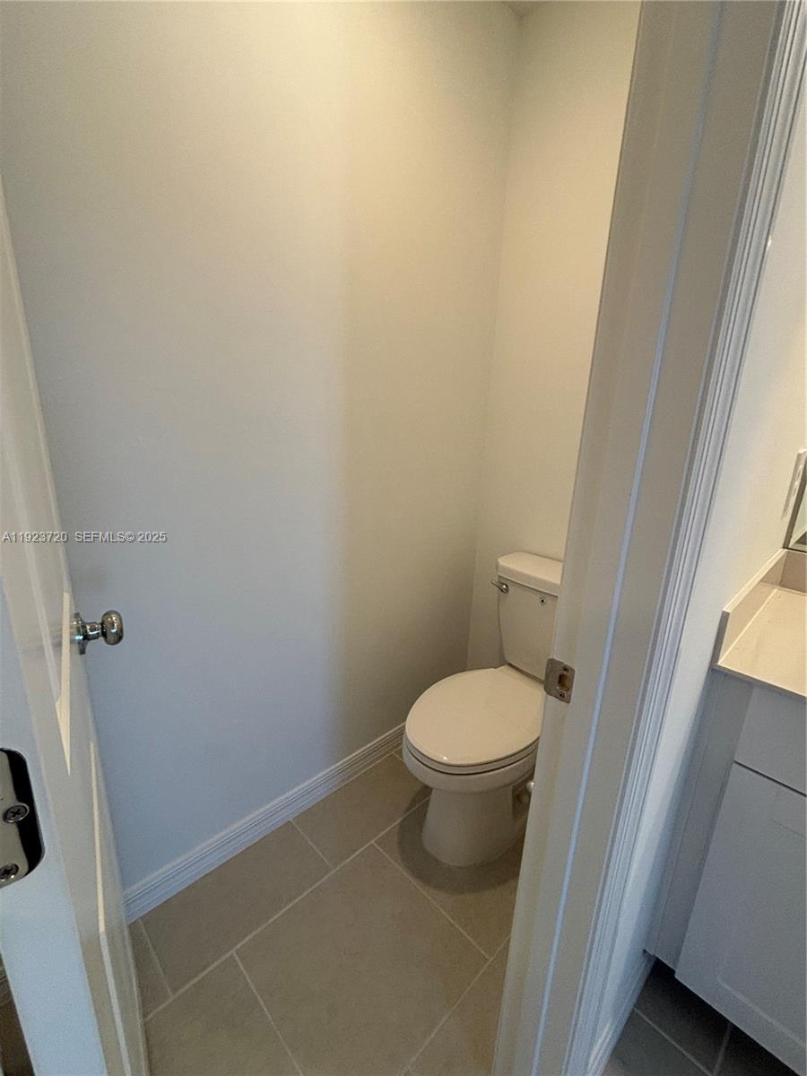 17459 Monte Isola Way Fort Myers, FL 33917 - Photo 22 of 24 a white toilet sitting next to a sink