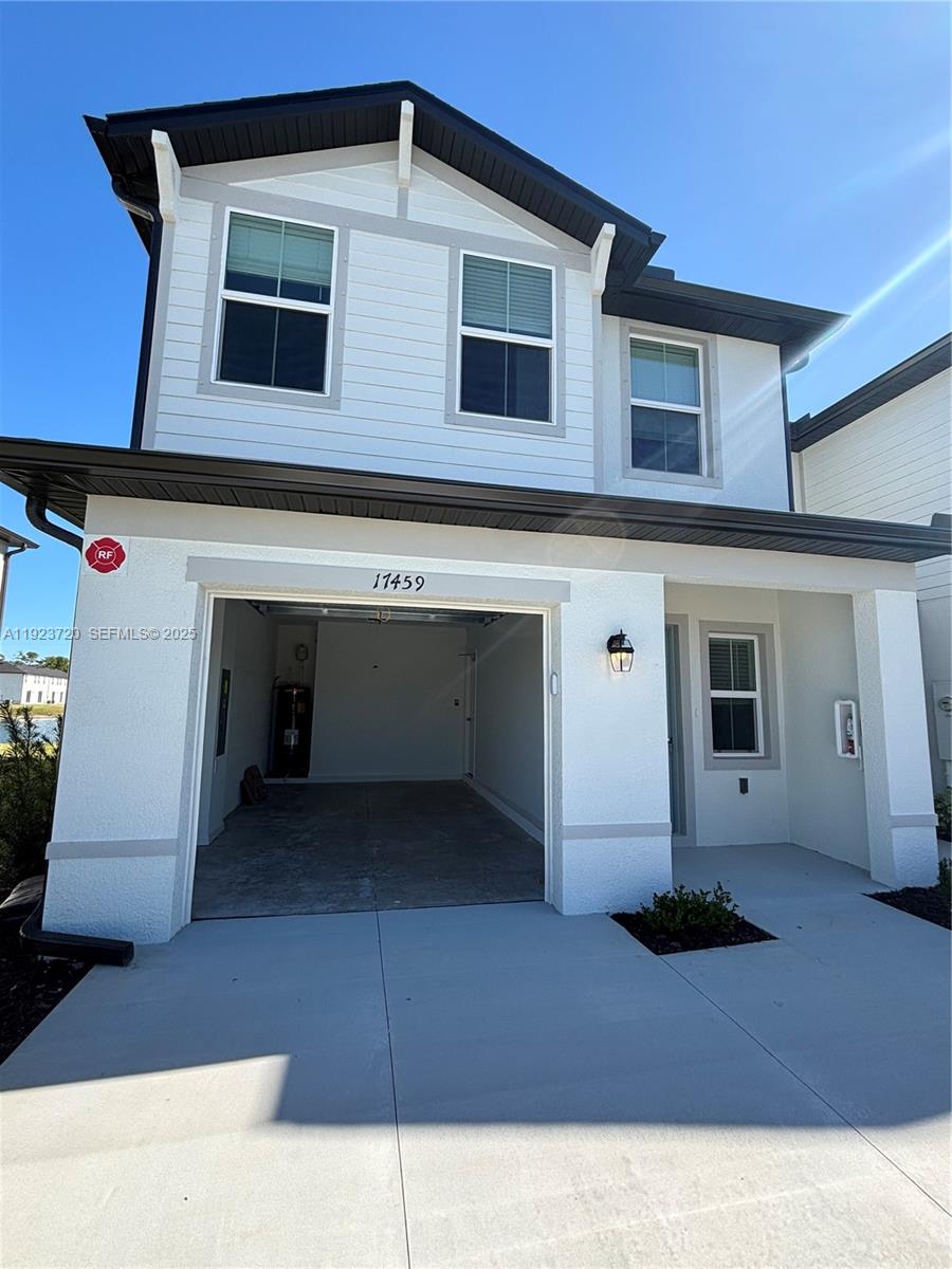17459 Monte Isola Way Fort Myers, FL 33917 - Photo 24 of 24 a front view of a house with garage