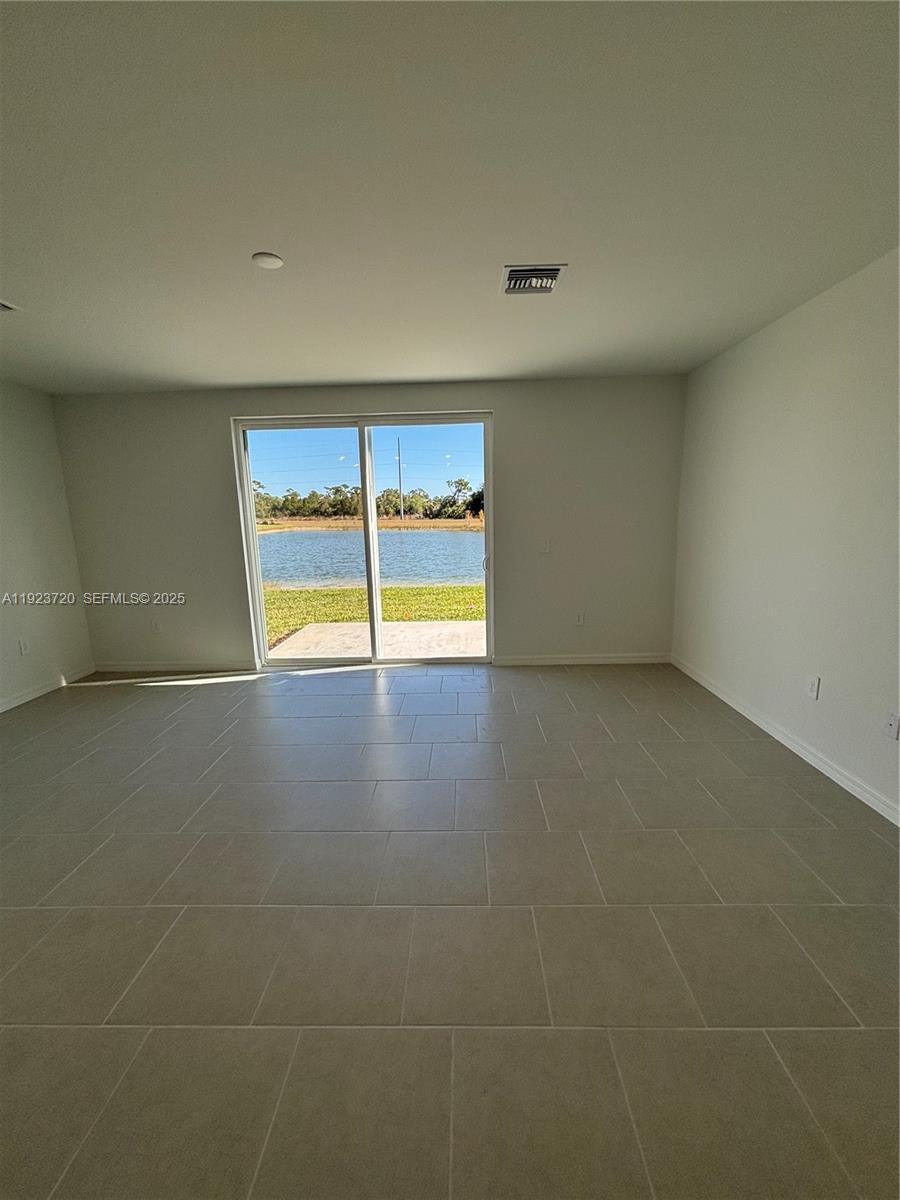 17459 Monte Isola Way Fort Myers, FL 33917 - Photo 3 of 24 a view of an empty room with a window