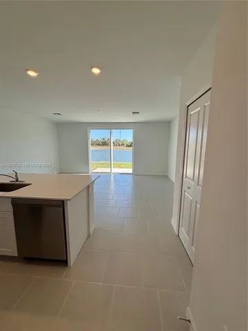 a view of an empty room with a fireplace