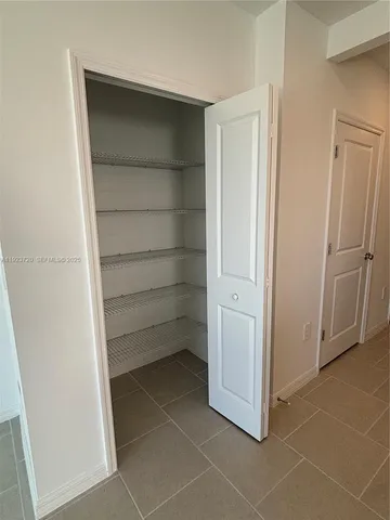 a view of an empty walk in closet
