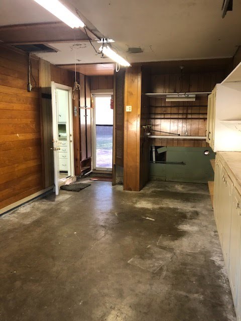 6841 Concho Street Houston, TX 77074 - Photo 14 of 17 a view of a hallway with wooden shelves