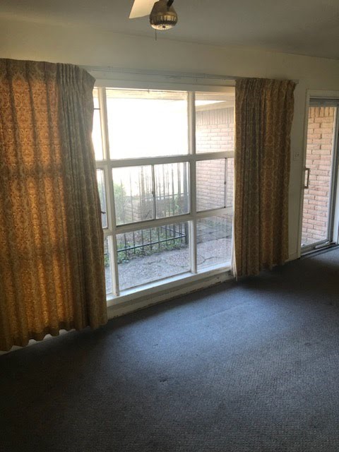 6841 Concho Street Houston, TX 77074 - Photo 3 of 17 an empty room with windows