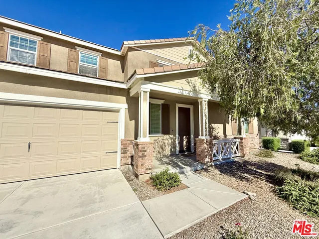 a front view of a house with a outdoor space