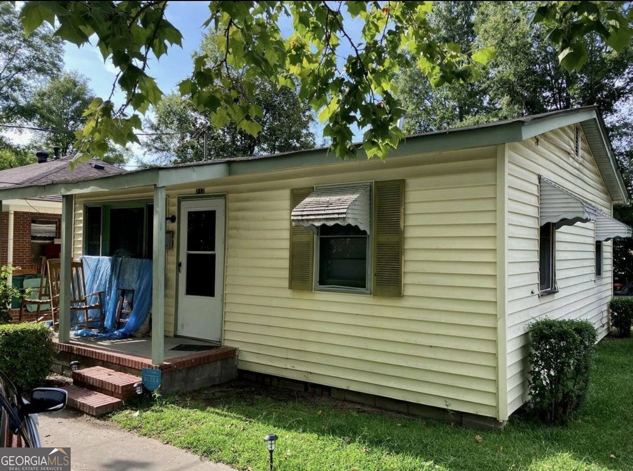 212 Whitehead Street Thomson, GA 30824 - Photo 2 of 9 a front view of a house with a yard