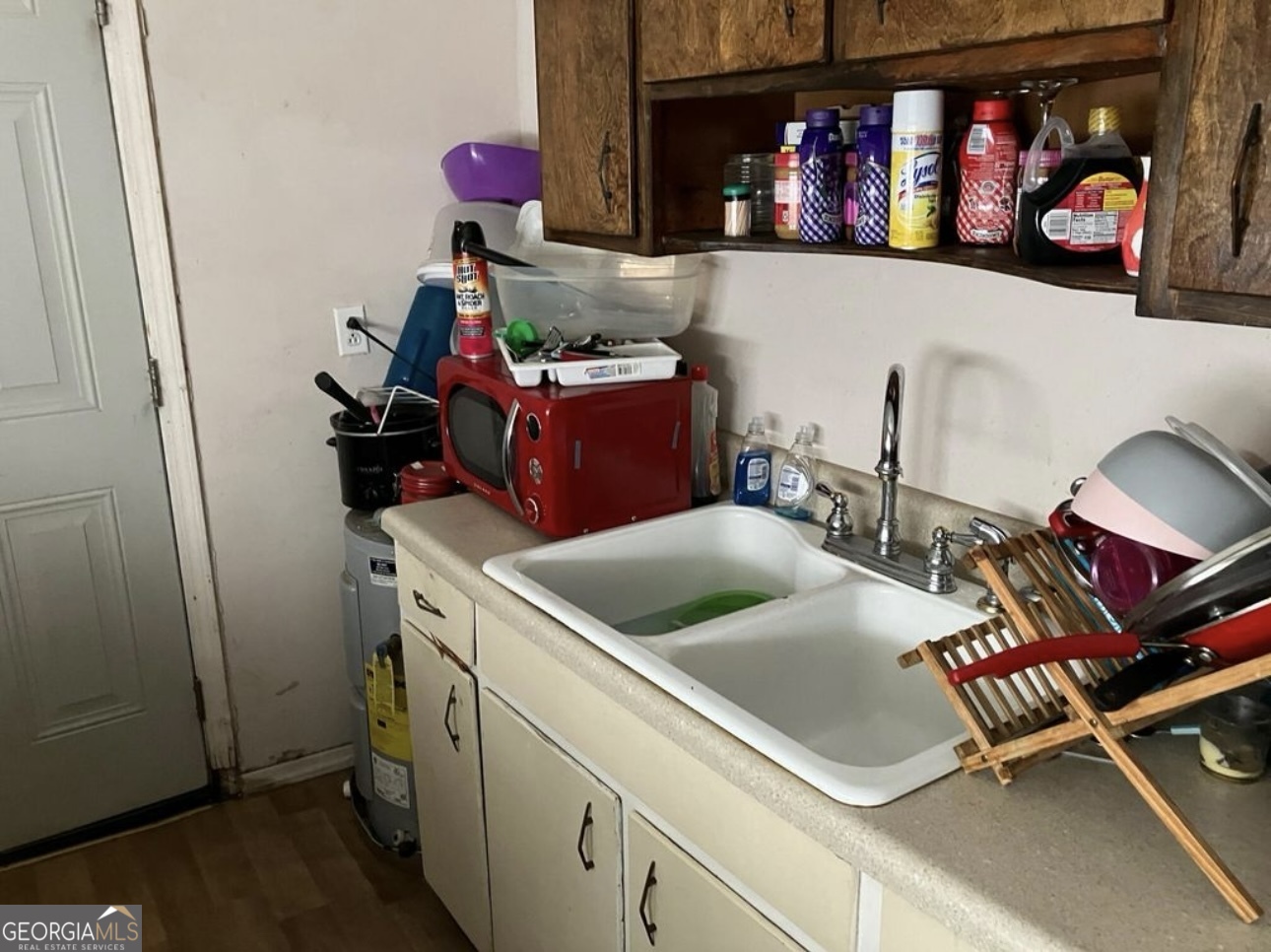 212 Whitehead Street Thomson, GA 30824 - Photo 4 of 9 a room with storage and utility