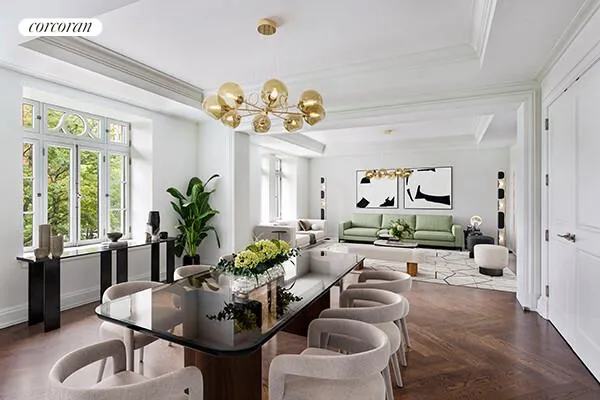 a living room with furniture chandelier and a chandelier