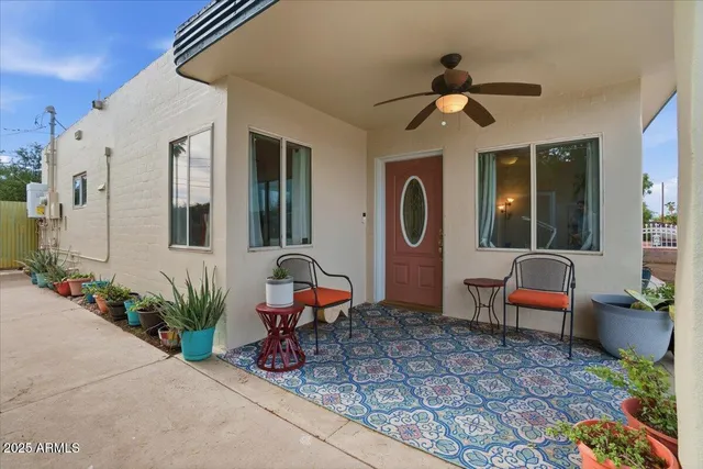 a front view of a house with outdoor seating