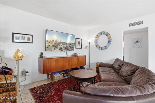 a living room with furniture and a table