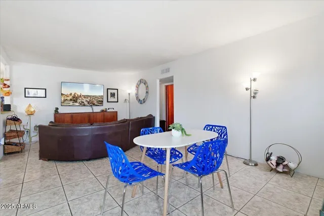 a dining room with furniture and window