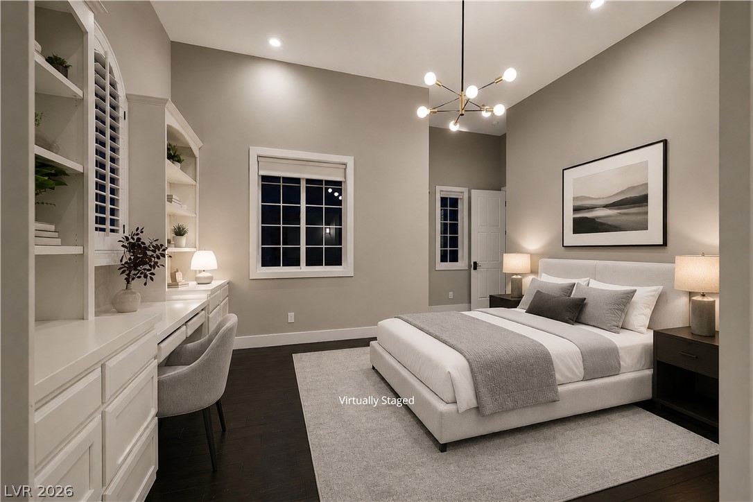 6 Rue Du Ville Henderson, NV 89011 - Photo 13 of 99 “Virtually Staged” peaceful bedroom retreat features abundant light and built-in shelving, perfect for relaxation and productivity.