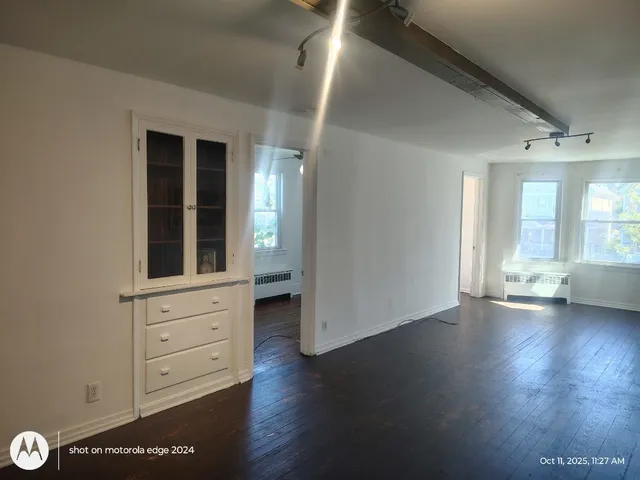 a kitchen with a sink a refrigerator a stove a microwave and cabinets