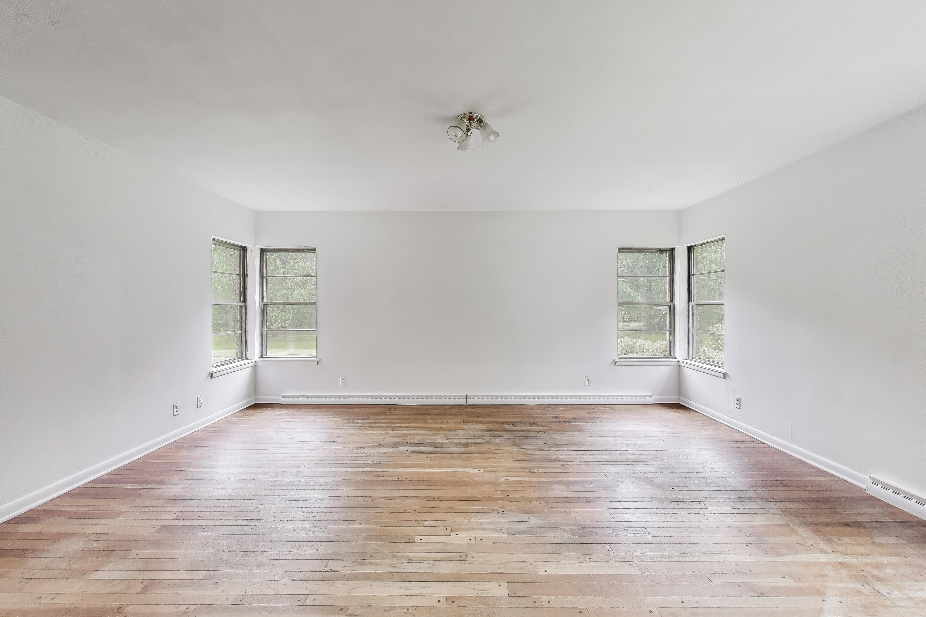 451 Johnson Road Trail Creek, IN 46360 - Photo 16 of 55 a view of an empty room with wooden floor and a window