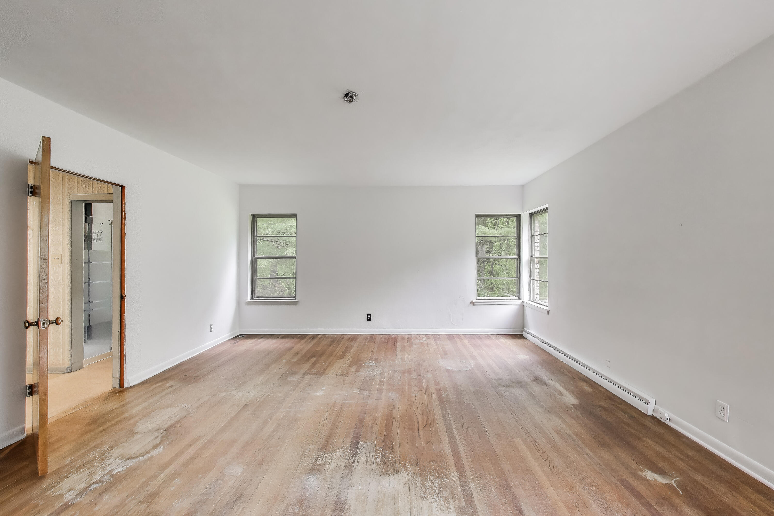 451 Johnson Road Trail Creek, IN 46360 - Photo 26 of 55 an empty room with wooden floor and windows