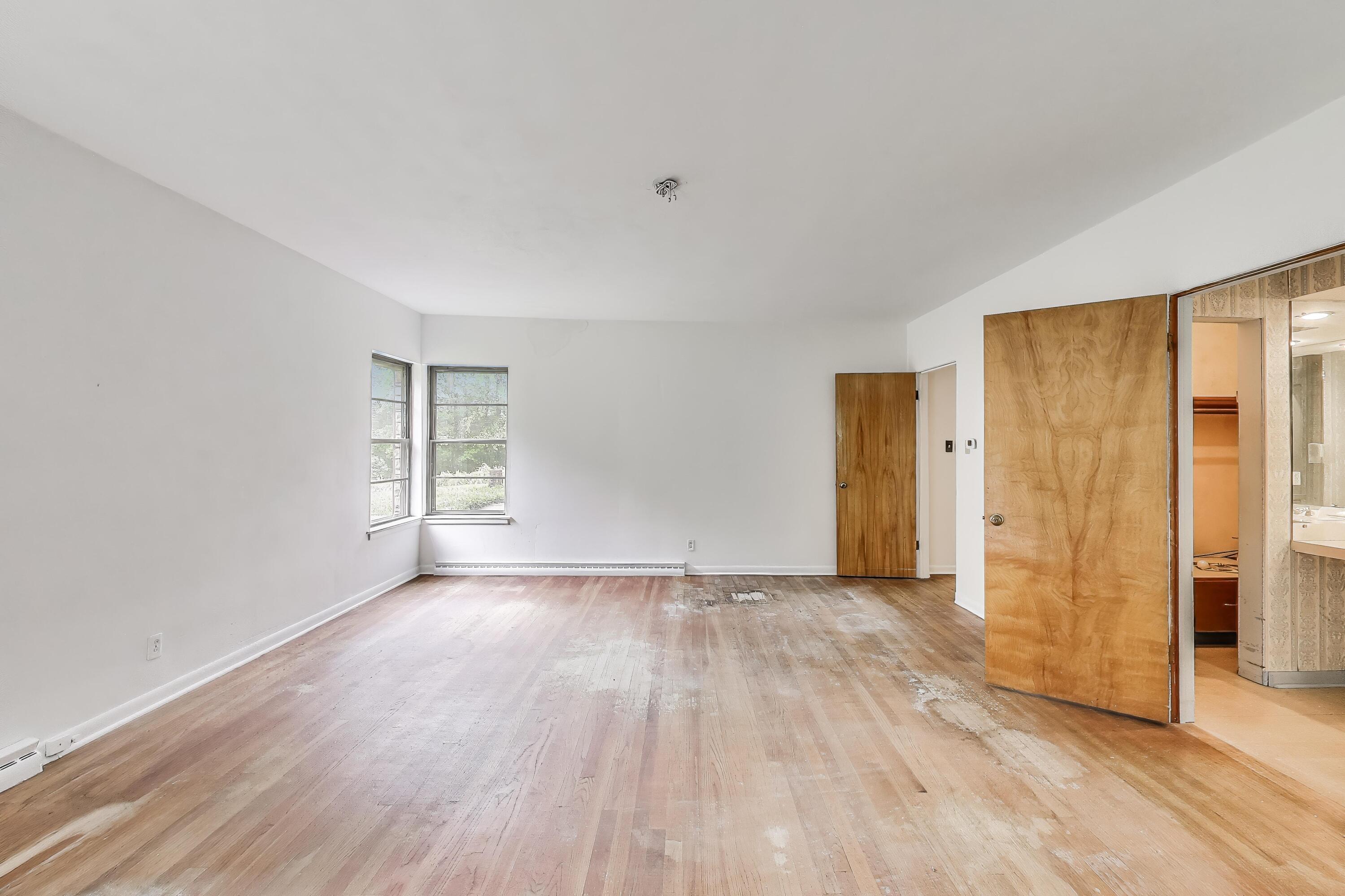 451 Johnson Road Trail Creek, IN 46360 - Photo 28 of 55 a view of an empty room with wooden floor and a window