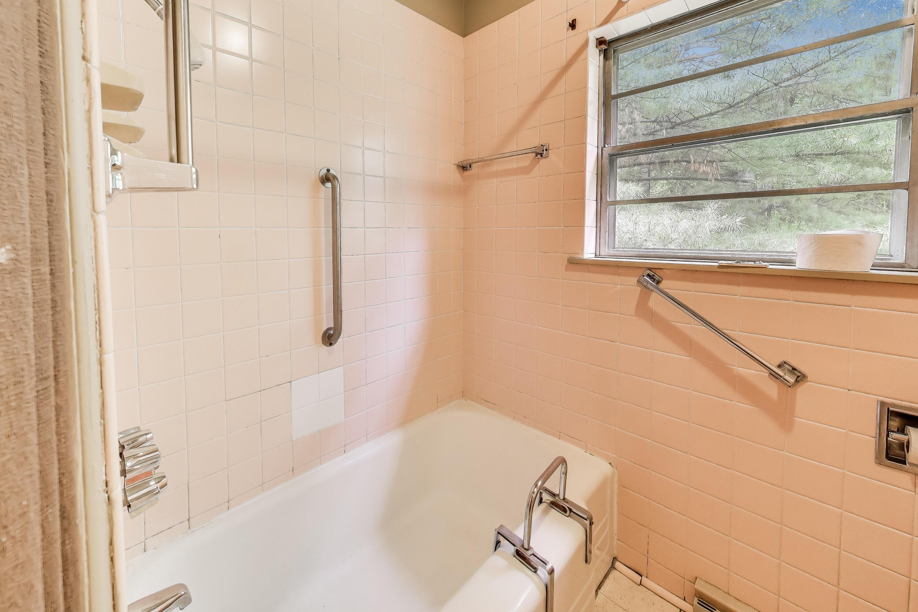 451 Johnson Road Trail Creek, IN 46360 - Photo 35 of 55 a bathroom with a bathtub and shower