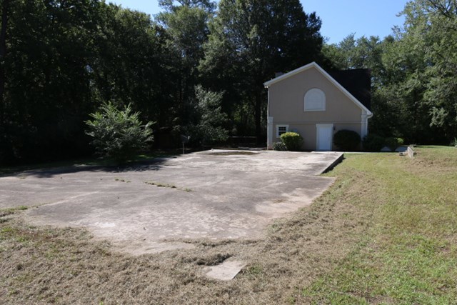 355 Bass Road Macon, GA 31210 - Photo 18 of 24 a front view of a house with a yard