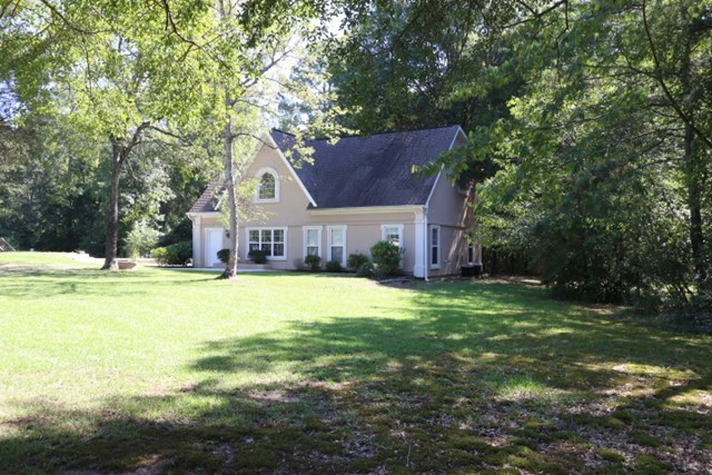 355 Bass Road Macon, GA 31210 - Photo 23 of 24 a front view of a house with a yard and garage