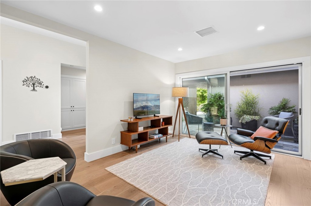 3 Rue Cannes Newport Beach, CA 92660 - Photo 13 of 46 Comfortable secondary living room providing flexible space for relaxing or entertaining with easy indoor-outdoor flow.