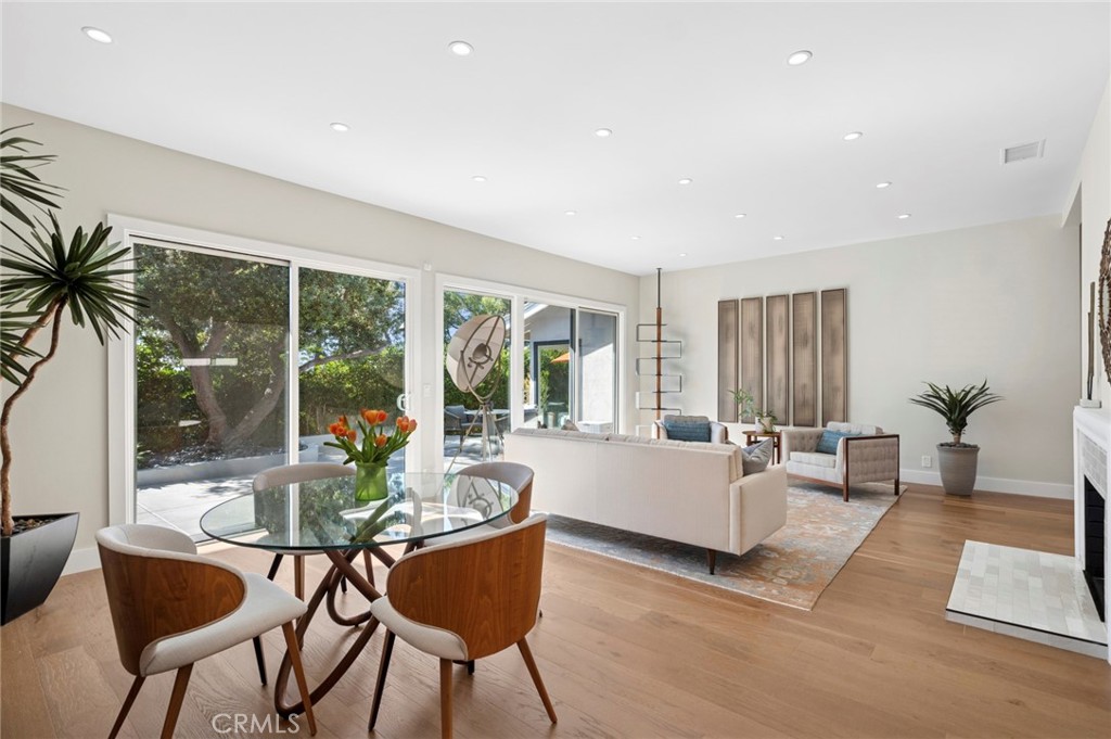 3 Rue Cannes Newport Beach, CA 92660 - Photo 4 of 46 Light-filled dining area positioned beside sliding doors, creating a bright setting with seamless access to outdoor spaces.
