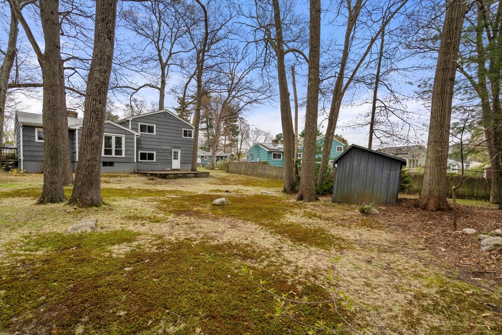 18 Royce Road Framingham, MA 01701 - Photo 28 of 30 a view of a large white house with a large tree in front of it