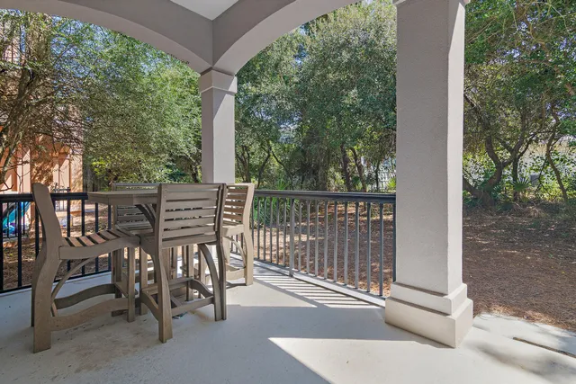 a view of a chairs and table in the patio