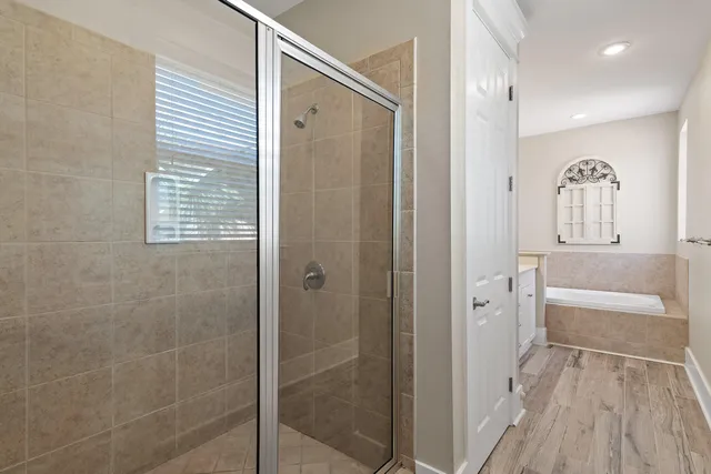 a bathroom with a bathtub and a shower