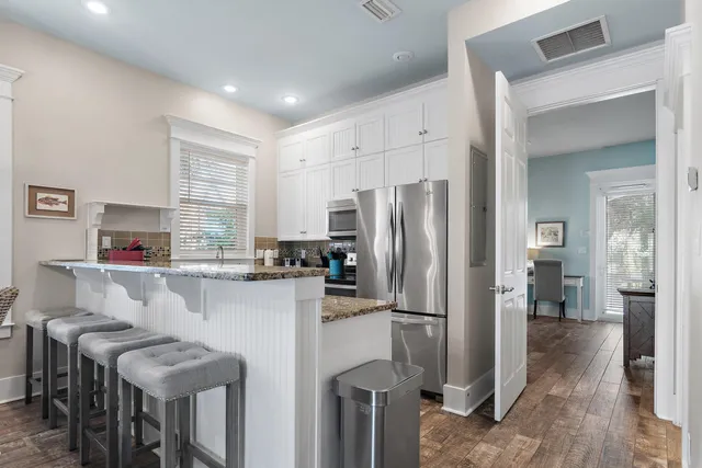 a kitchen with stainless steel appliances a refrigerator and a stove