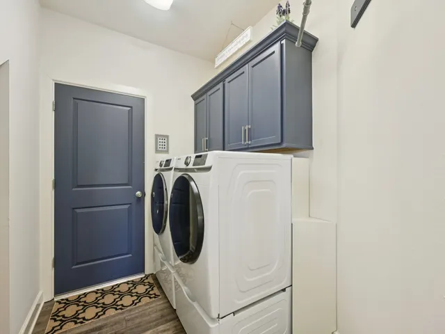 a white bath tub sitting next to a shower