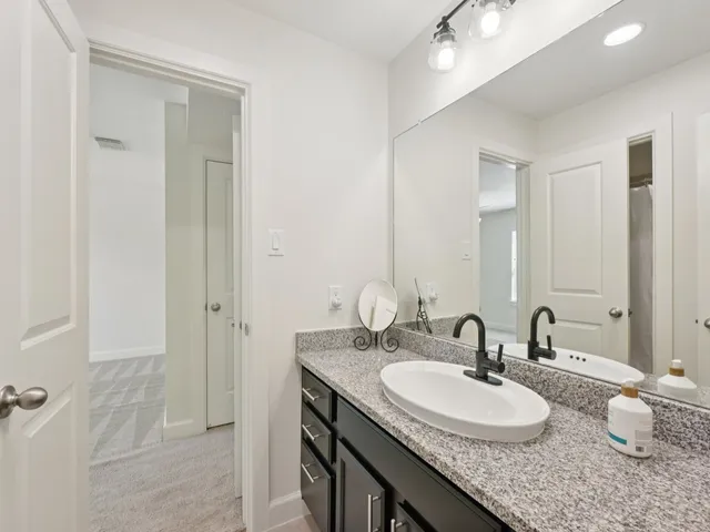 a bedroom with a bed and a table in it