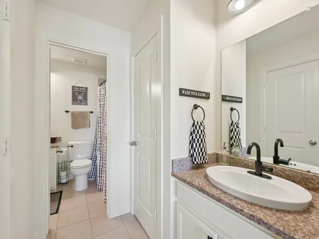 a view of an empty room with a ceiling fan