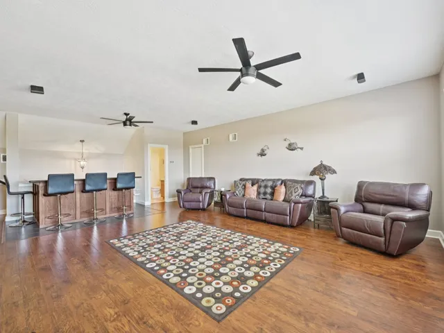 a living room with furniture rug and window