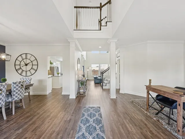 a view of a room with furniture and wooden floor