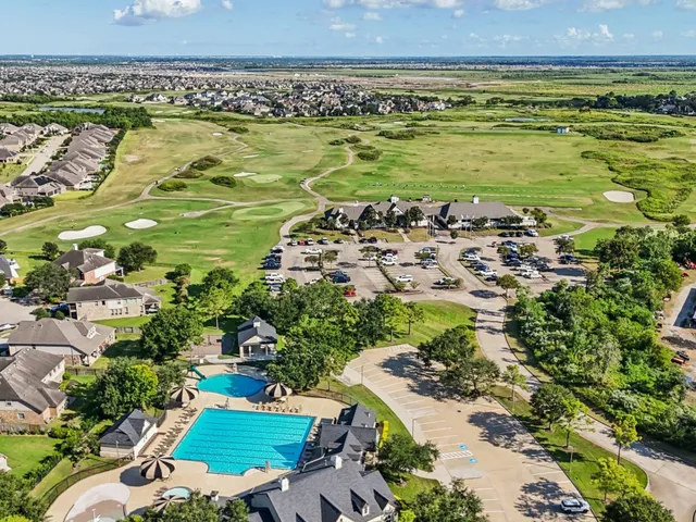 a view of a house with backyard porch and sitting area