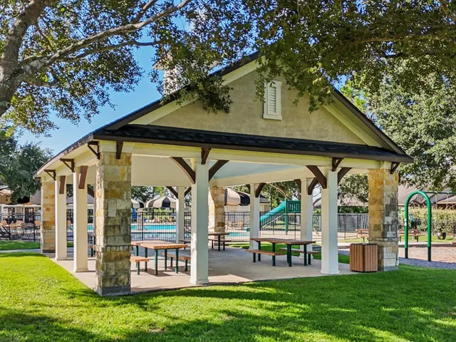 an aerial view of a house swimming pool and garden
