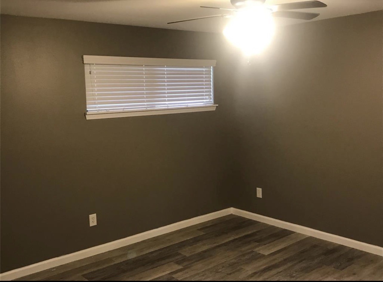 2515 Jackson La Marque, TX 77568 - Photo 15 of 19 a view of an empty room with wooden floor and a window