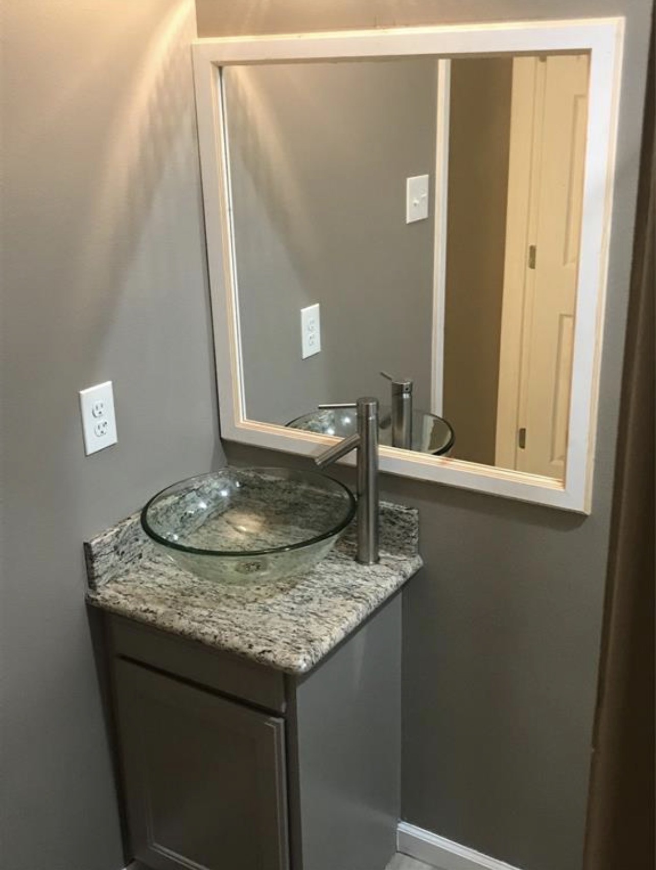 2515 Jackson La Marque, TX 77568 - Photo 19 of 19 a bathroom with a granite countertop sink and a mirror