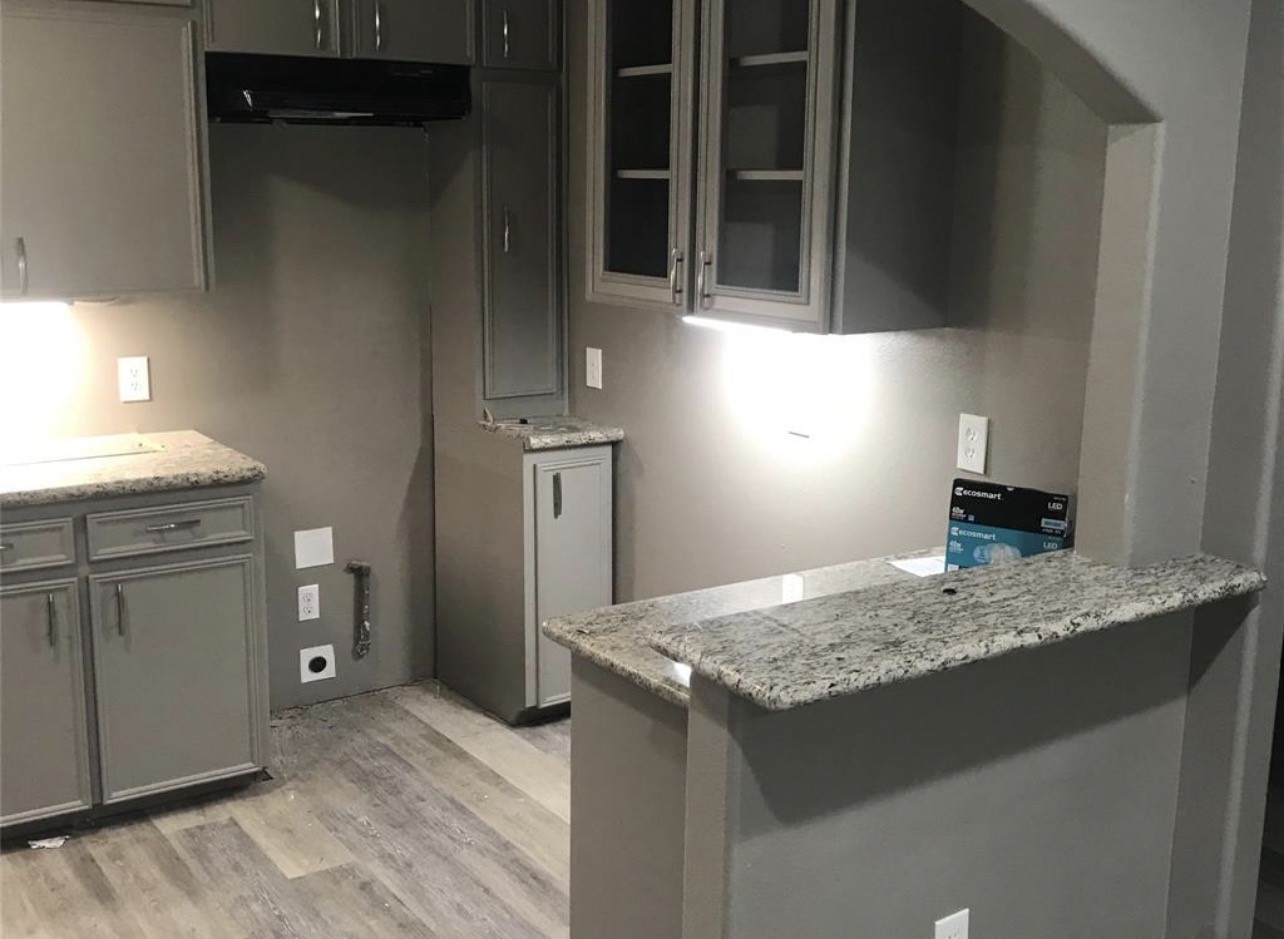 2515 Jackson La Marque, TX 77568 - Photo 3 of 19 a kitchen with a granite countertop sink and dishwasher