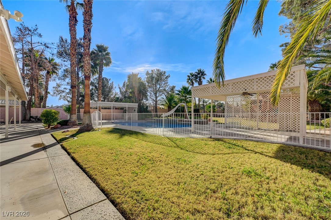 2955 El Camino Road Las Vegas, NV 89146 - Photo 80 of 99 Fenced backyard with a patio area and a playground