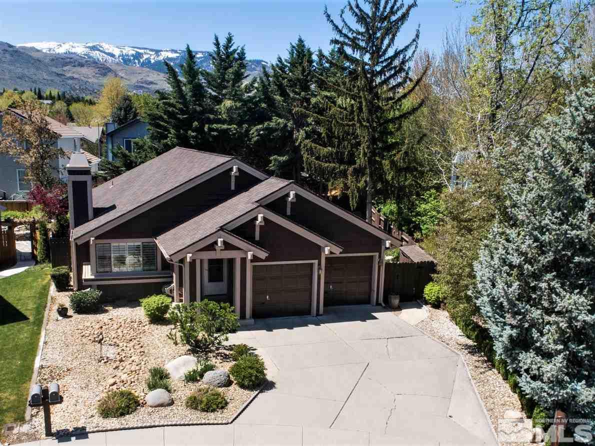 145 Riverhaven Place Reno, NV 89519 - Photo 1 of 23 a front view of a house with a garden