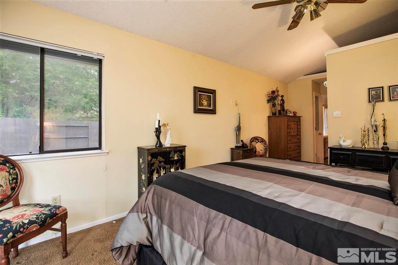 145 Riverhaven Place Reno, NV 89519 - Photo 12 of 23 a bedroom with a bed and a window