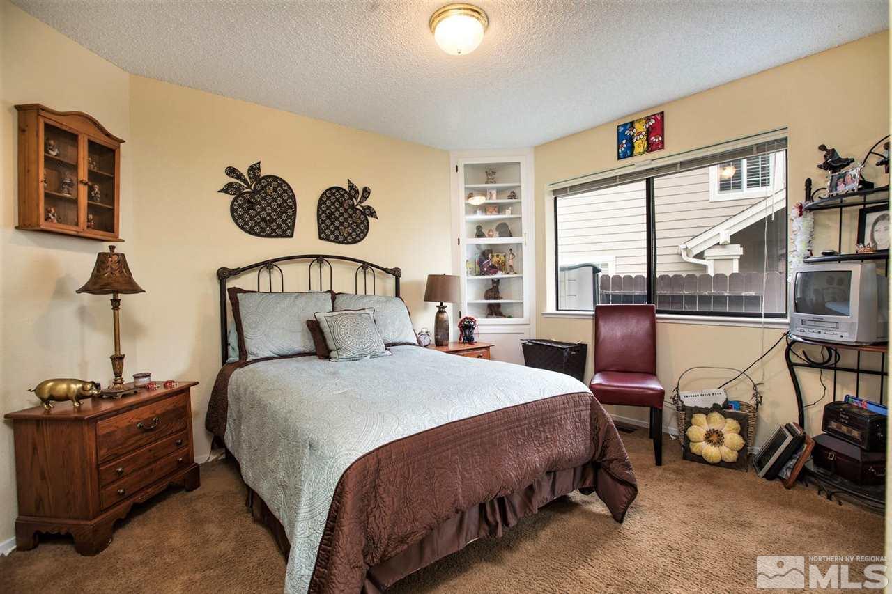145 Riverhaven Place Reno, NV 89519 - Photo 14 of 23 a bedroom with a bed and a window