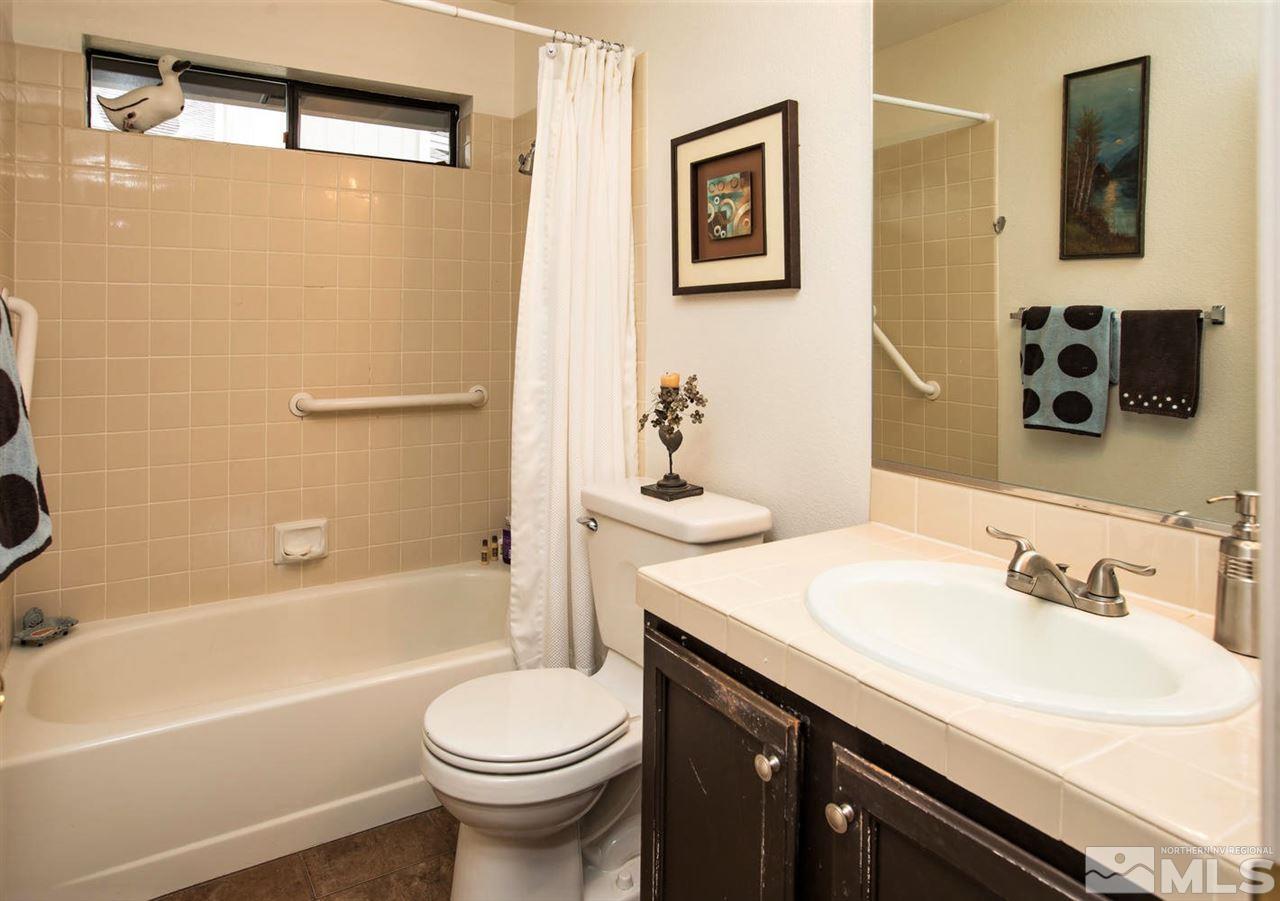 145 Riverhaven Place Reno, NV 89519 - Photo 16 of 23 a bathroom with a sink a toilet and shower