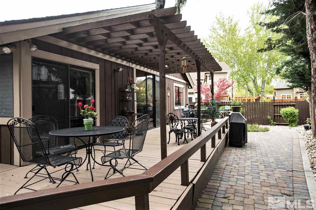 145 Riverhaven Place Reno, NV 89519 - Photo 18 of 23 a view of a chairs and table in patio with a barbeque