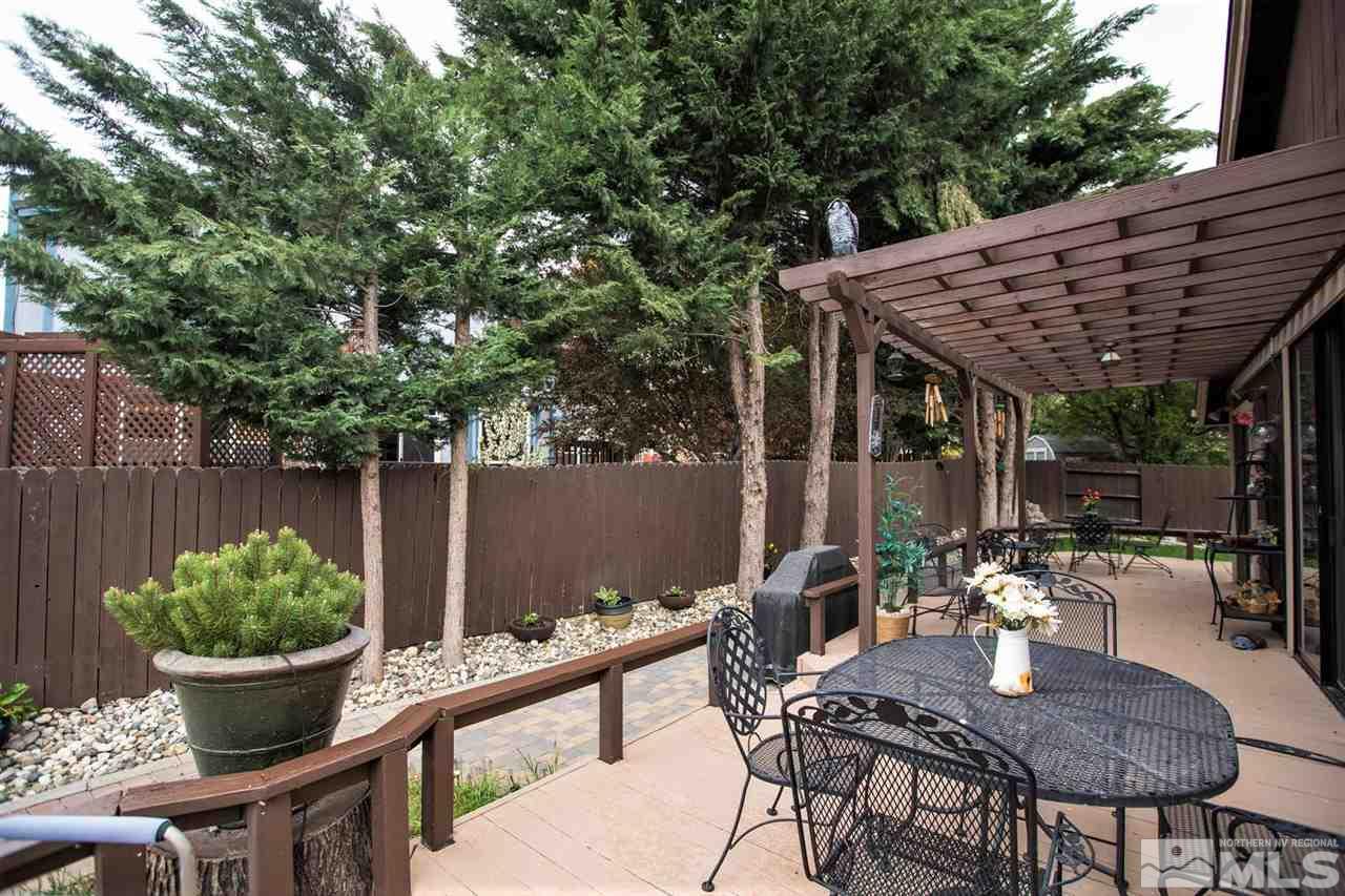 145 Riverhaven Place Reno, NV 89519 - Photo 19 of 23 a outdoor dining space with furniture and potted plants