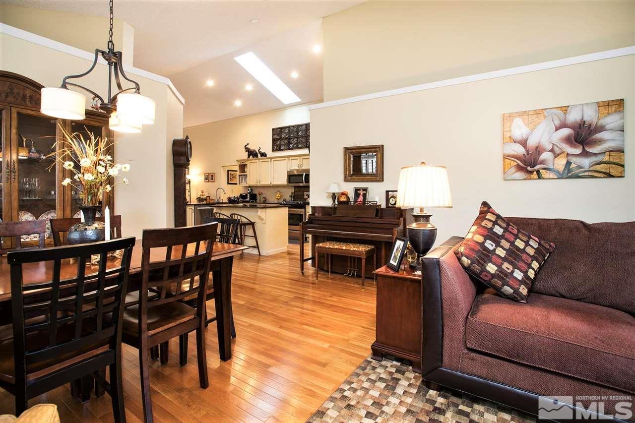 145 Riverhaven Place Reno, NV 89519 - Photo 5 of 23 a living room with furniture a dining table and a piano