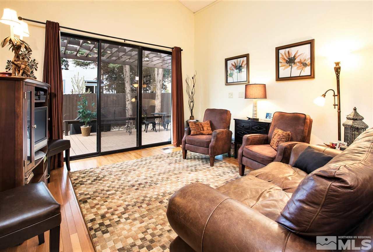 145 Riverhaven Place Reno, NV 89519 - Photo 6 of 23 a living room with furniture and a floor to ceiling window