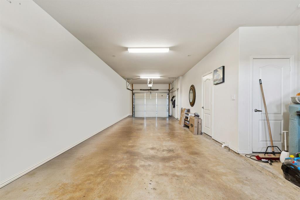 722 East 1st Street Fort Worth, TX 76102 - Photo 24 of 25 Jumbo sized tandem garage with enough room for 3 cars and plenty of storage.