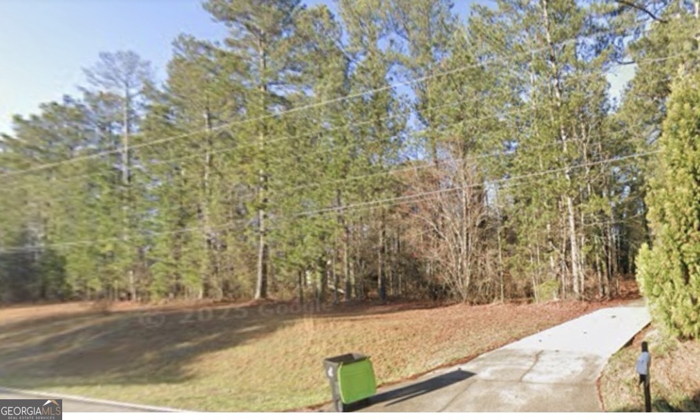 221 Oak Grove Road McDonough, GA 30253 - Photo 1 of 3 a view of a backyard of the house