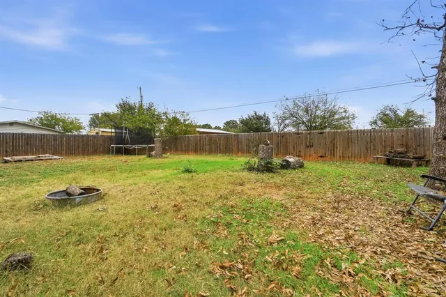 a view of a lake with a yard